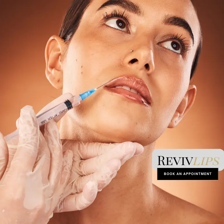 A woman receiving a lip filler injection as part of the RevivLIP treatment at Reviv Beauty Med Spa, highlighting precise and professional care for enhanced lips.