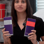 Kristen-Anne Thomas FNP-BC holding Juvederm products in hands.