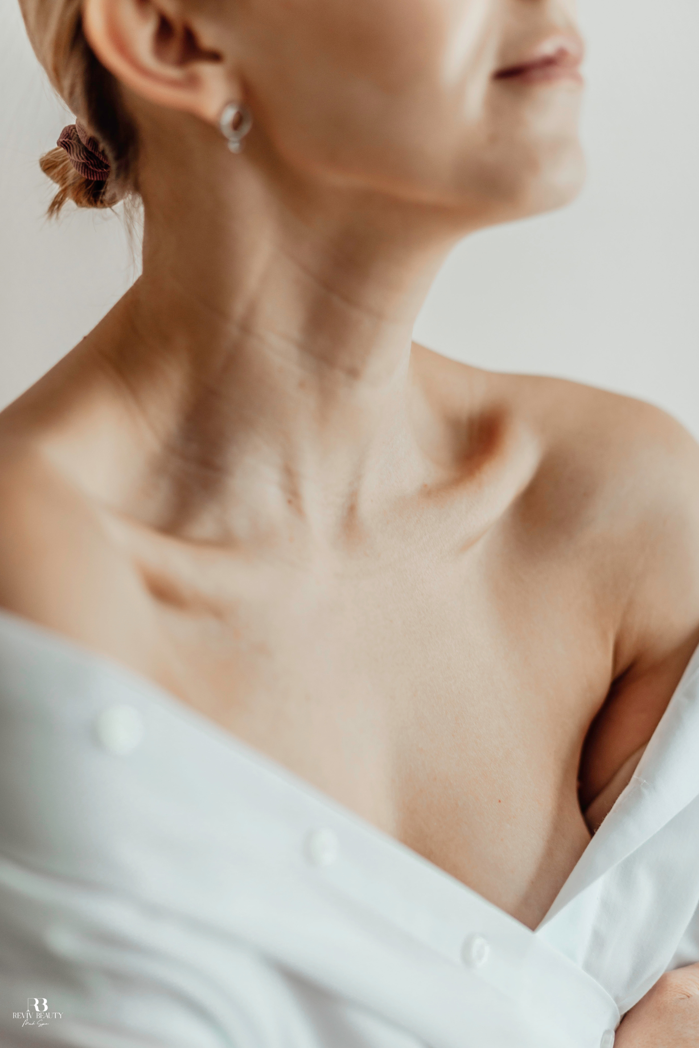 Close-up of smooth neck and chest skin showing hydration and rejuvenation after a skin booster treatment at Reviv Beauty Med Spa in Sanford, FL.